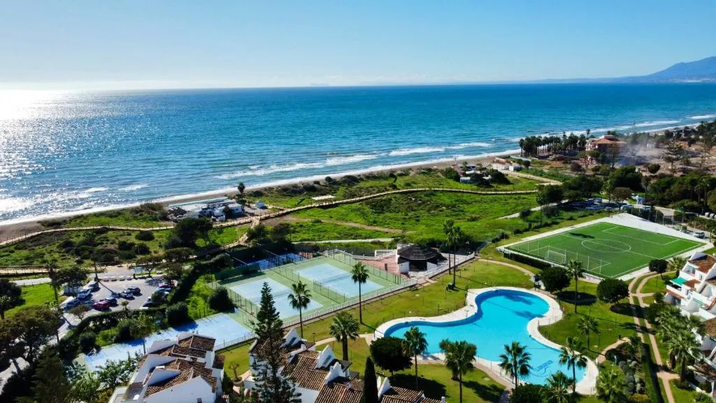 Image of Lunamar beachfront with swimming pool, football, tennis, paddle and basketball courts – EaW Homes
